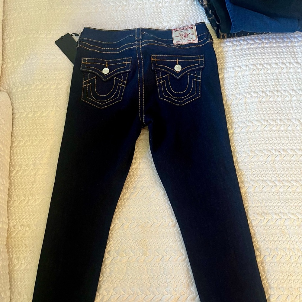 New mid rise super skinny jeans, dark blue jeans, size 29 runs smaller.